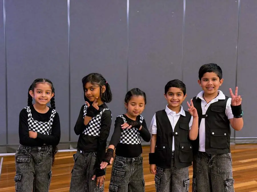 Junior group in checkerboard costumes
